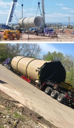 A vessel being craned at site and secured on a lowboy trailer