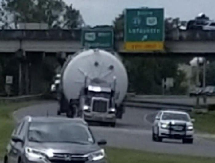 A turbine blade being guided beneath a highway overpass